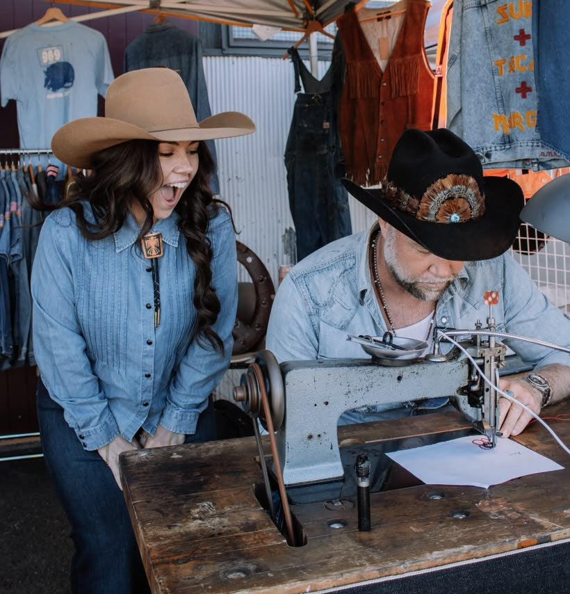 Live chainstitch embroidery artist personalizing a garment for a guest at a Los Angeles event
