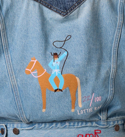 Close-up of Lottie Rae’s Dollie cowgirl embroidery on a limited-edition Levi’s denim jacket