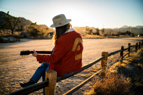 Pioneertown custom western jacket with embroidered and patch details worn in the desert