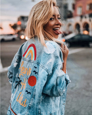 Custom denim jacket created for Aggie Lal with colorful embroidered back artwork and western-inspired details