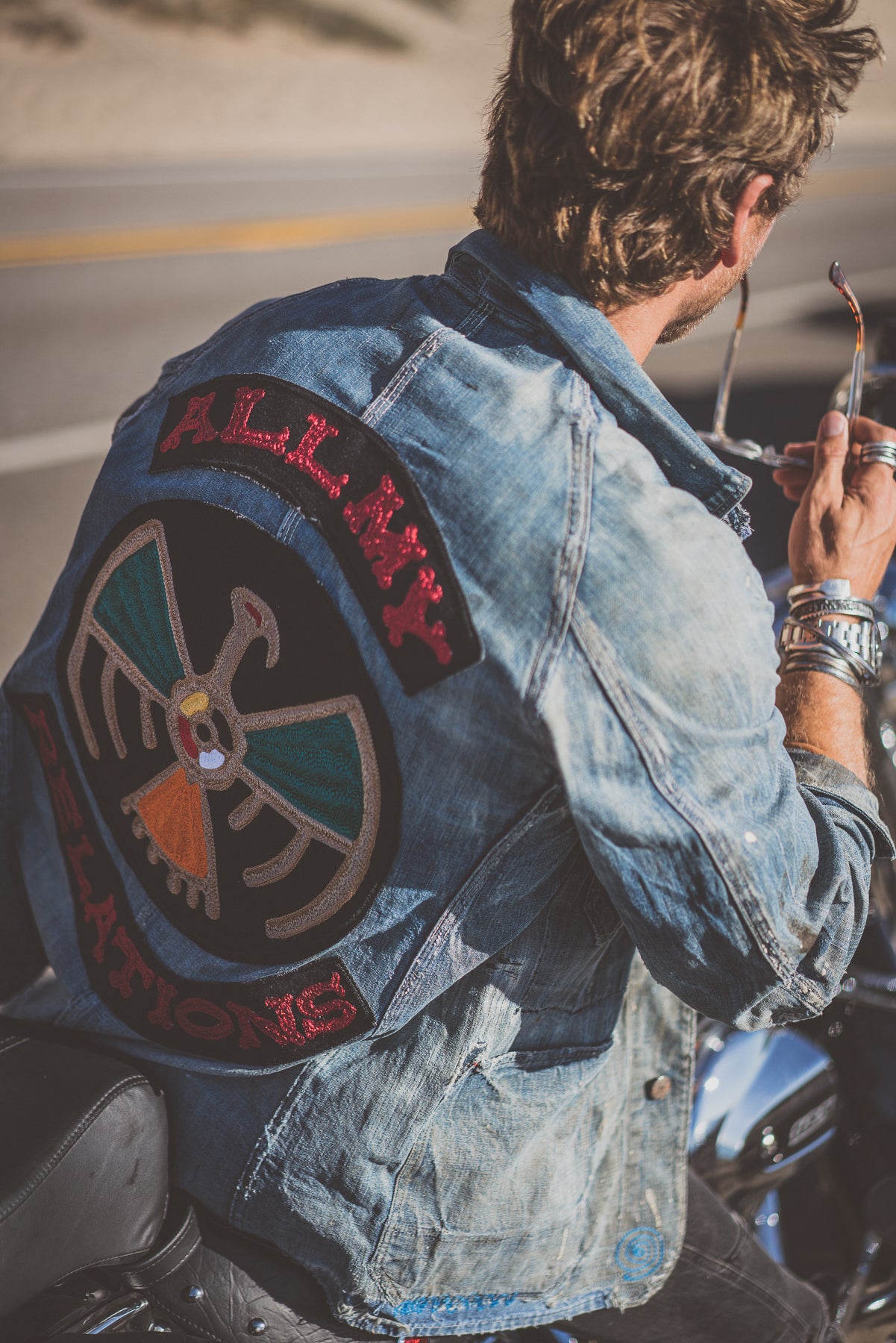 Custom denim embroidery created for jewelry designer Buck Palmer, featuring bold back artwork and patch details, shot in Los Angeles
