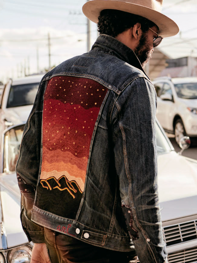 Custom chainstitch embroidered denim jacket with hand-stitched desert landscape artwork