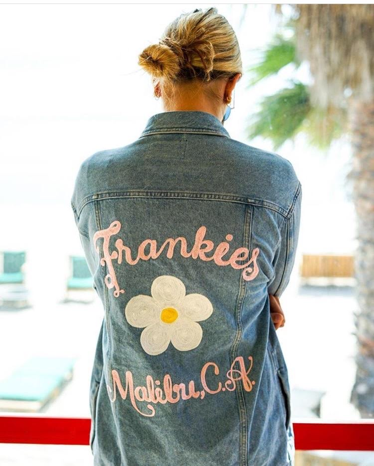 Custom denim jacket with chainstitch embroidery, floral design and Malibu, California lettering