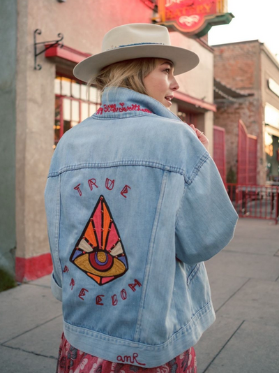 Custom chainstitch embroidered denim jacket with colourful Western back artwork
