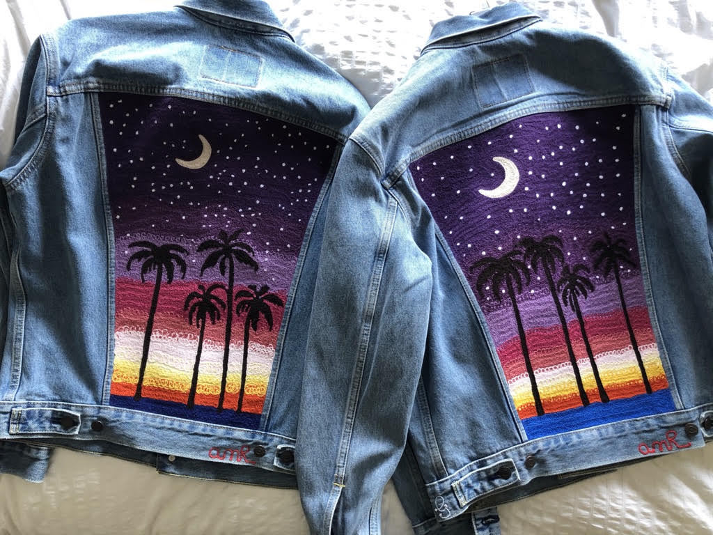 Custom chainstitch embroidered denim jackets with palm tree sunset artwork in Los Angeles