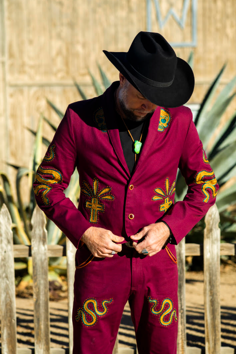 Custom chainstitch embroidered burgundy suit with Western-inspired artwork in Los Angeles