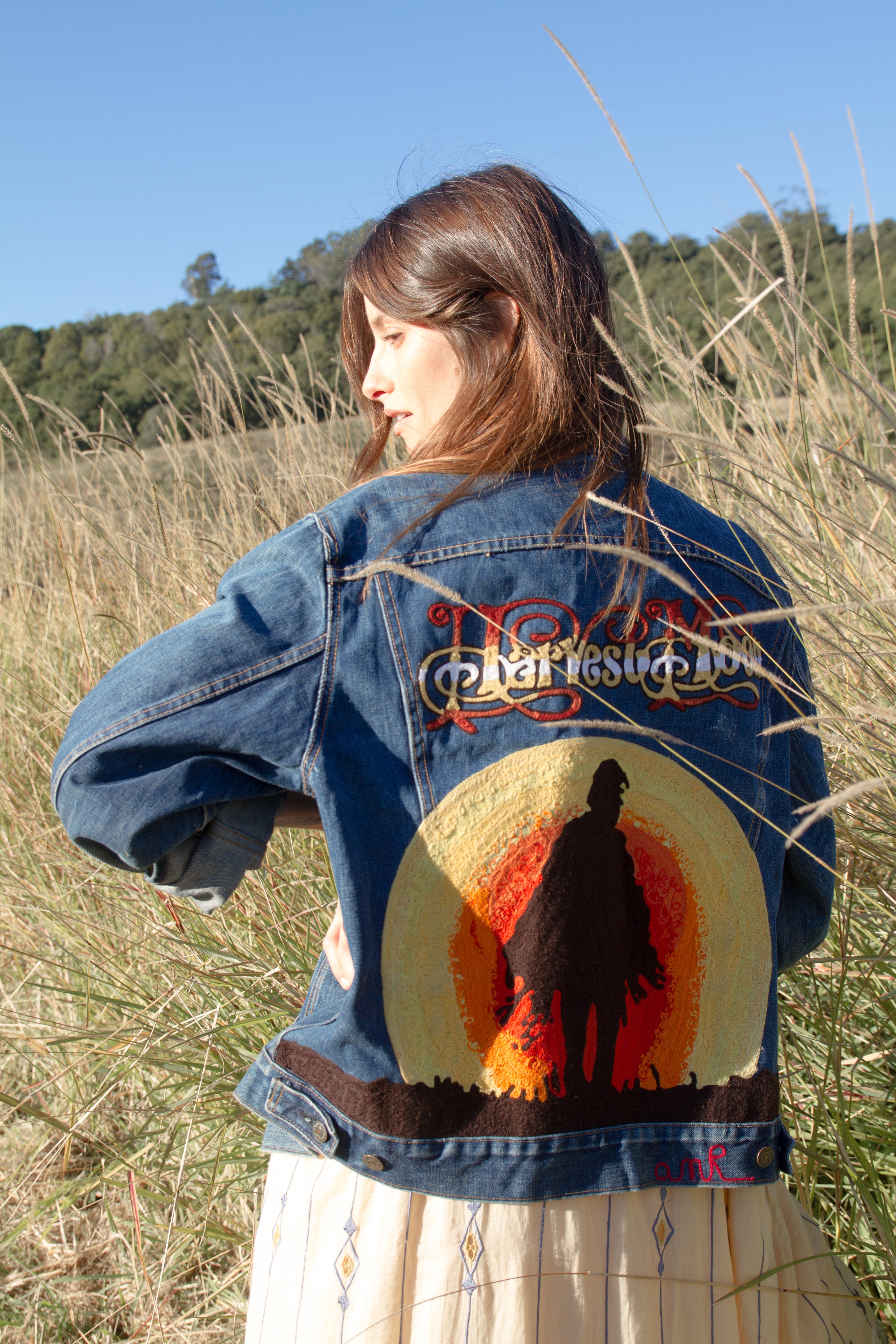 Custom Harvest Moon denim jacket with embroidered back artwork created in Los Angeles
