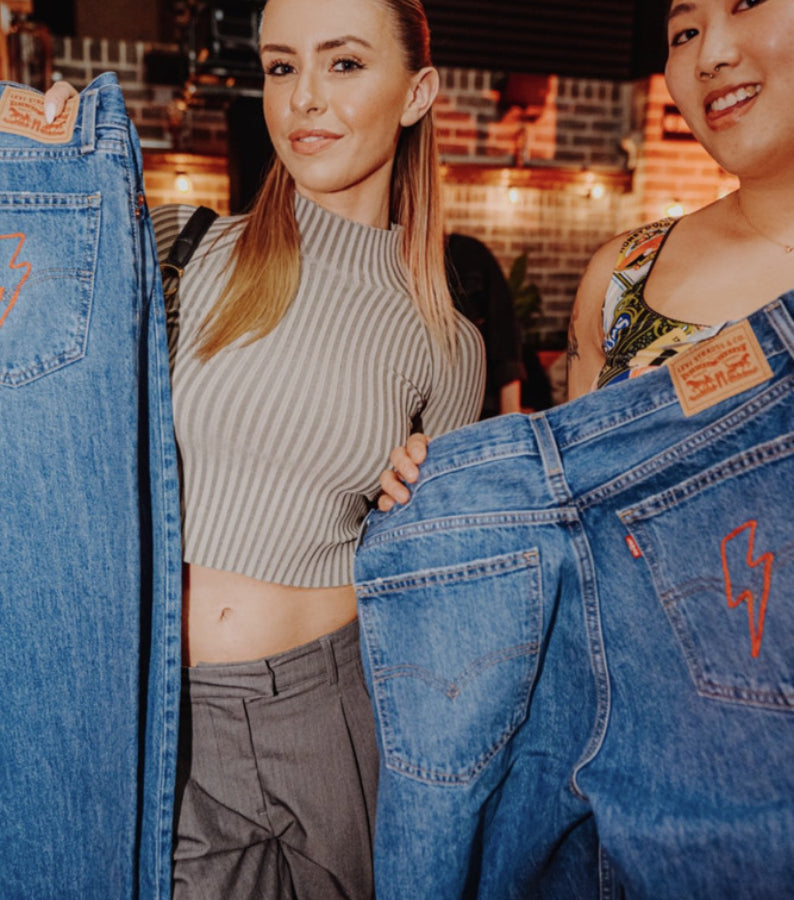 Guests displaying custom Levi’s jeans at the Levi’s 150th anniversary live chainstitch embroidery event in Los Angeles