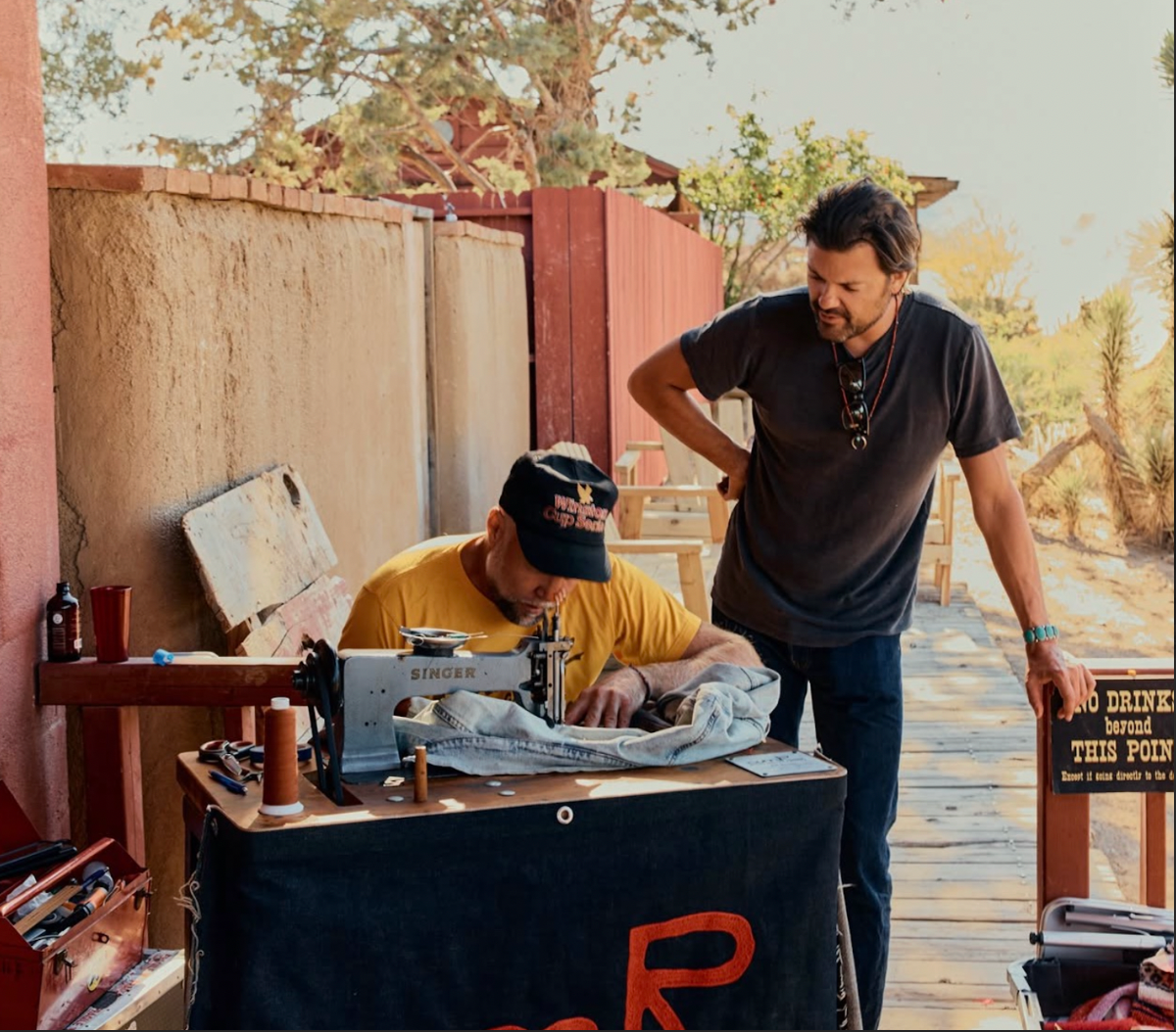 amR artist creating live chainstitch embroidery at an event in California
